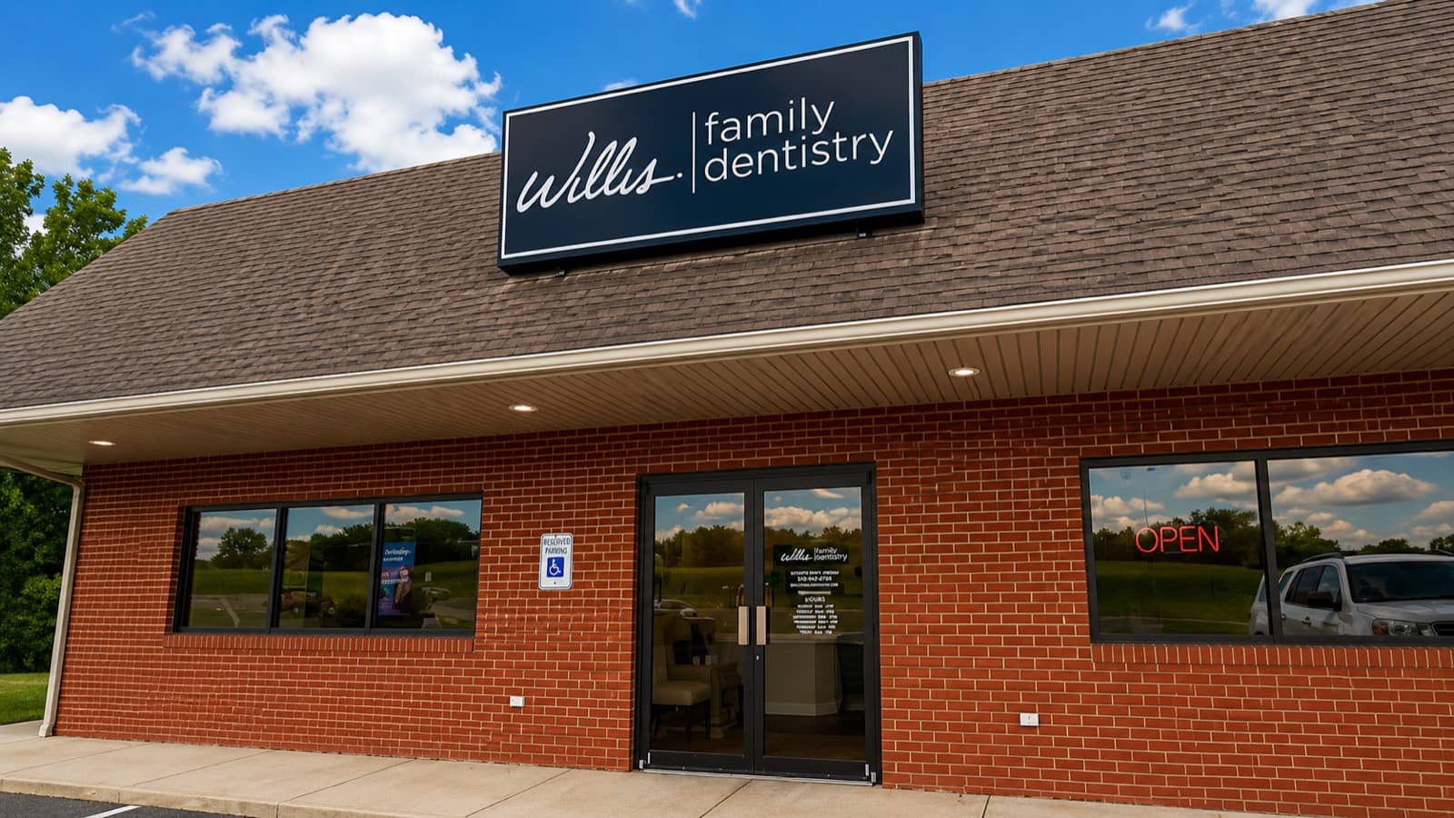 Front exterior of Willis & Associates Family Dentistry - Stuarts Draft on Stuarts Draft Highway, brick storefront with practice signage